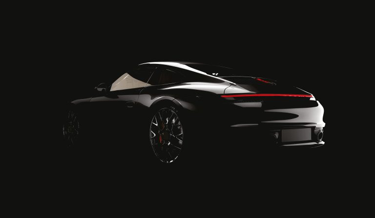 Black Porsche with Rave Gloss finish in shadow, showcasing premium Paint Protection Film for Cars