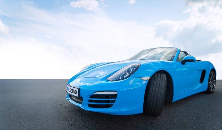 Blue Porsche with Legend license plate featuring PPF Select™ Plus, showcasing premium Paint Protection Film for Cars